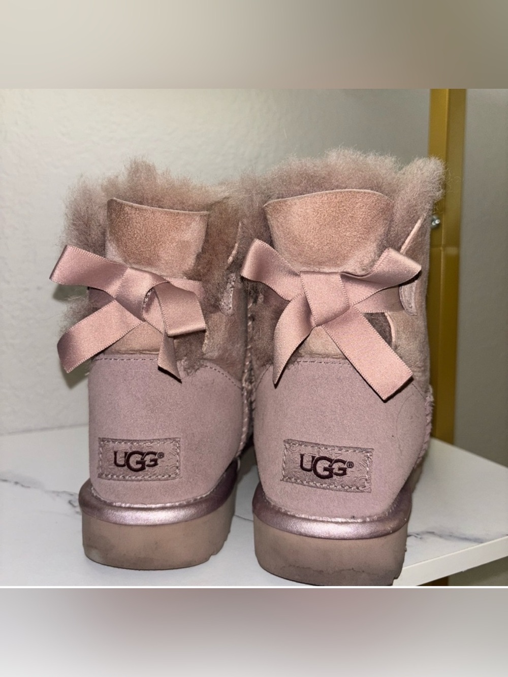UGG Pink Mini Bow Shearling Boots